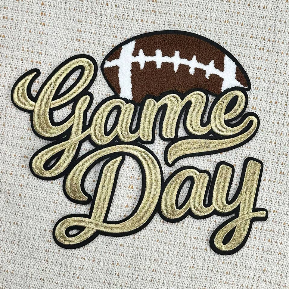 Gold Metallic Game Day Patch on Black Hoodie